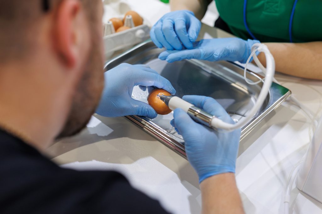 sinus-lifting-using-an-erbium-laser-on-a-raw-chicken-egg-the-dentist-conducts-training-1-1-1024x682